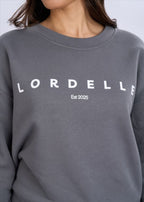 Grey sweatshirt with 'LORDELLIE' branding on a plain background